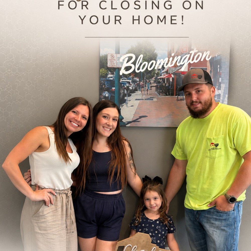 Lavinia Chudy celebrating a closing with clients in Bloomington, IN